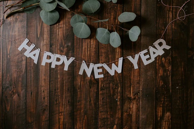 leaves and a garland saying happy new year