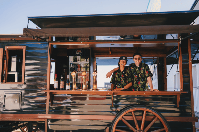 Maria and Ulrik smiling in their food truck in Moskenes, Lofoten