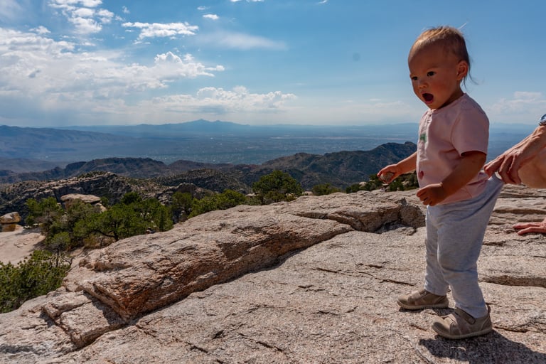 Aliya walking the rocks at Windy point vista
