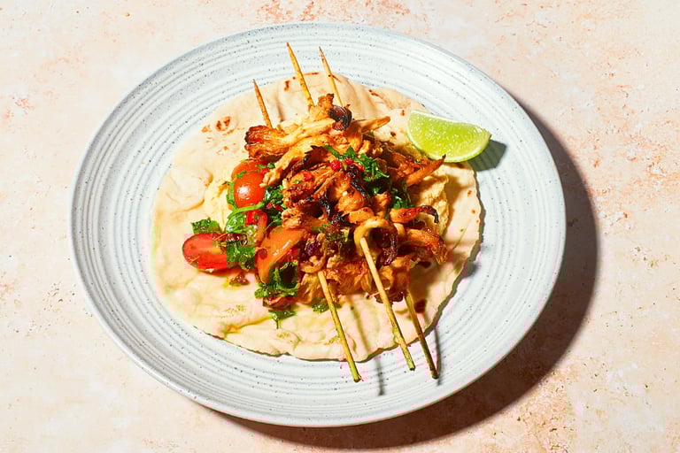 a plate of food with a harrisa oyster mushrooms and salsa