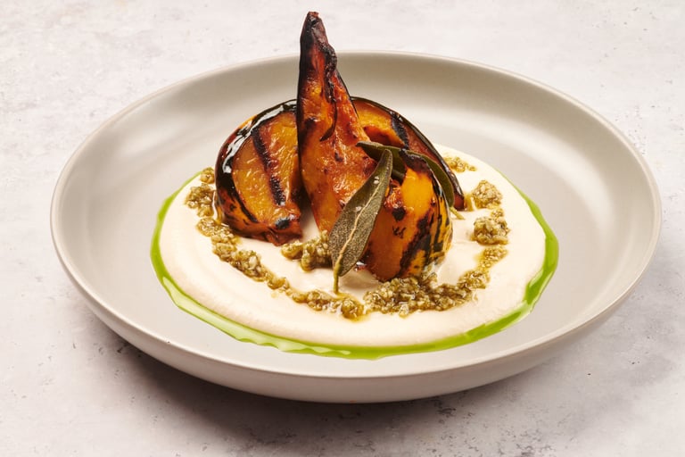 a plate of food with pumpkin and tofu