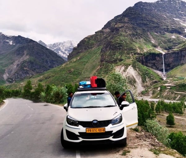 a car parked on a mountain side road