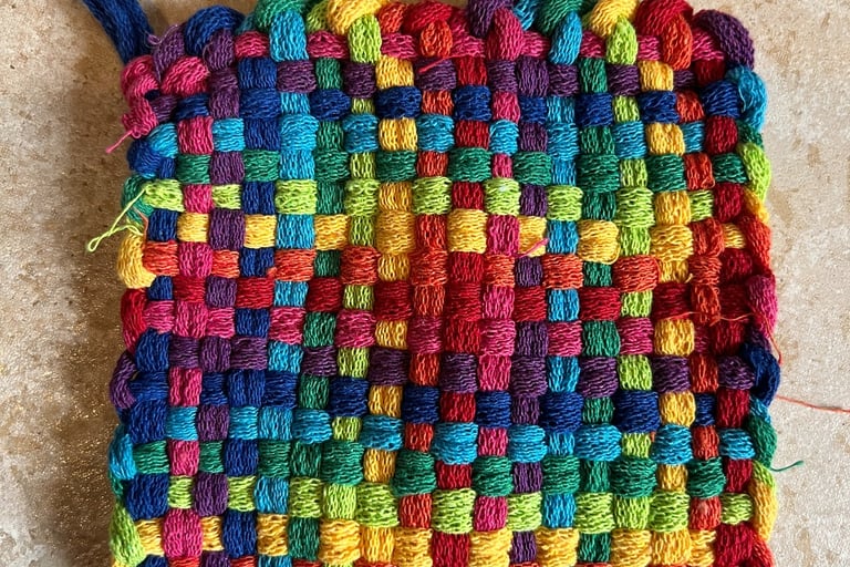 rainbow colored homemade pot holder