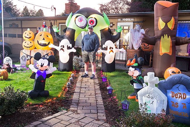 yard full of inflatable Halloween decorations