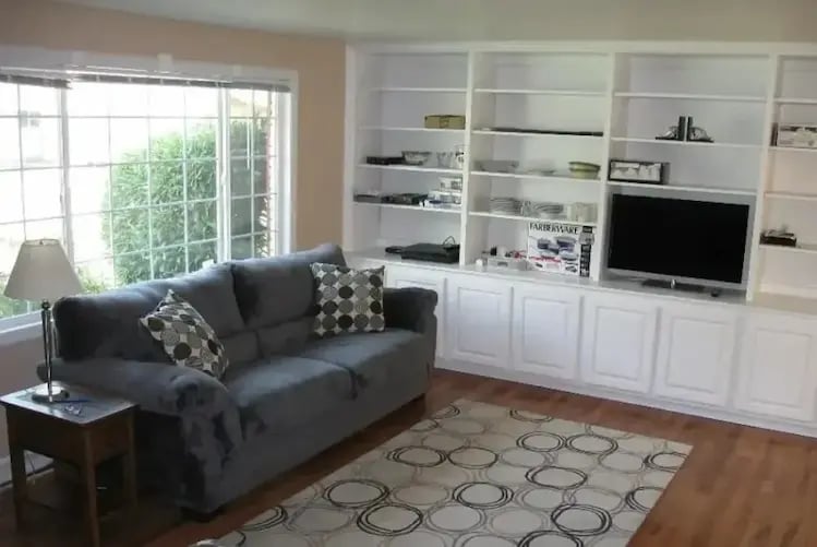 Furnished living room with built-in shelving at Malad House. Premium off-campus Boise State student housing near BSU.