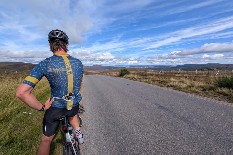 Cairn CC rider on the summit of Cairn O Mount