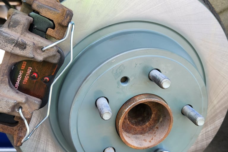 New brake pads and brake rotors installed on a vehicle near Waukee, Iowa by Fast T's Mobile Master Brake Technician
