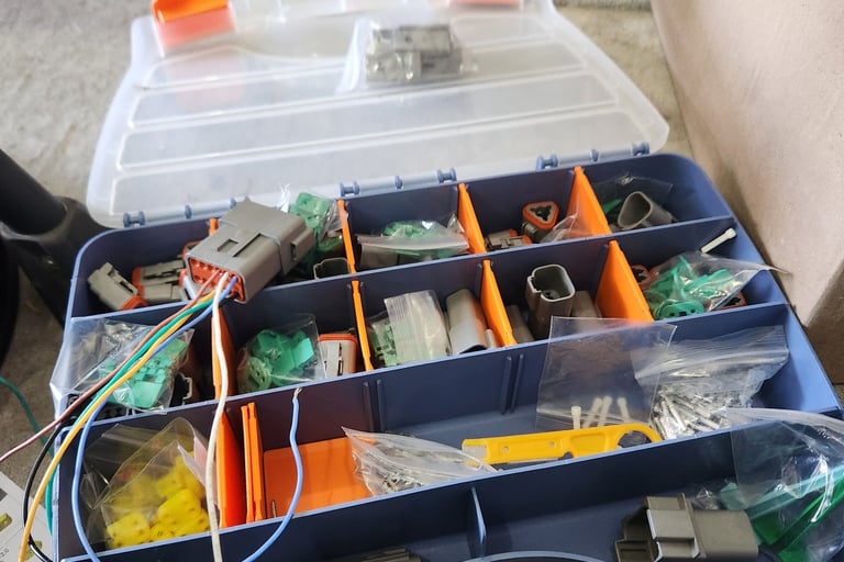 Automotive repinning and plug assortment on board Fast T's Mobile Service Trucks