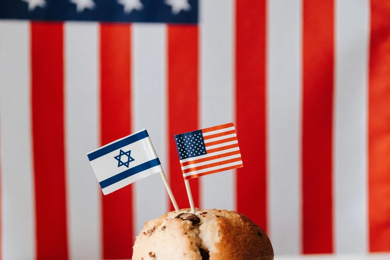 Photo of a muffin with tiny US and Israel flag on toothpicks
