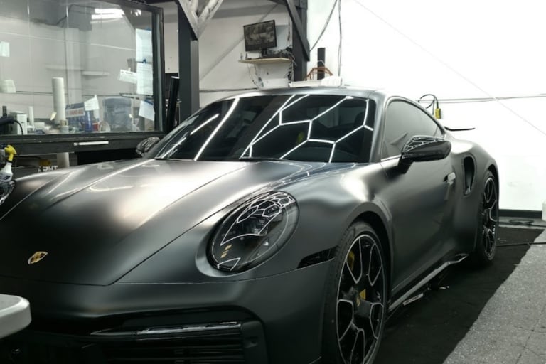 Satin PPF edge work on Porsche fender.