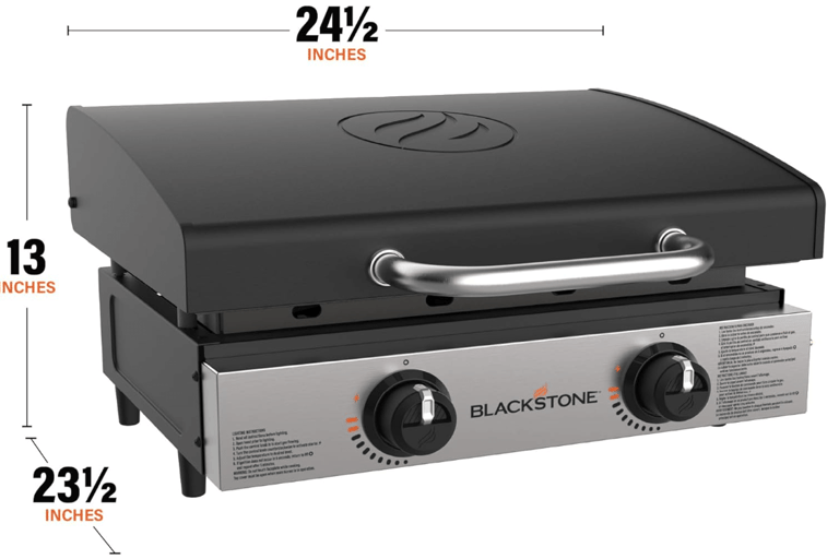 a black stone grilling station with a black and white grill