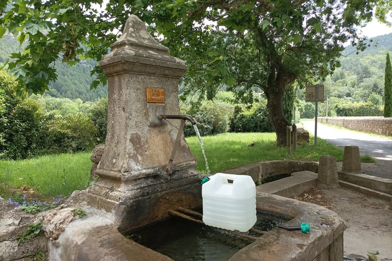 Collecting water from the village fontaine