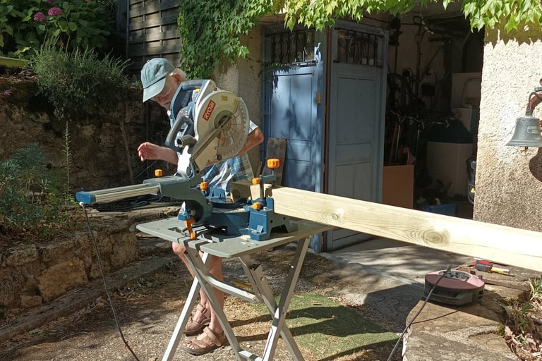 Sawing off three ends to give the roof a slight angle.
