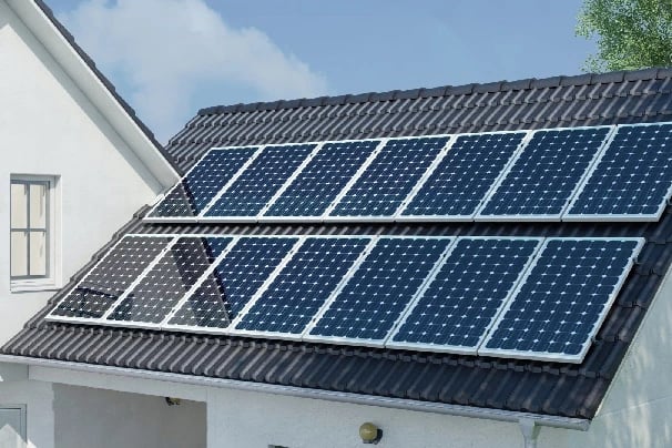 Residential rooftop solar panels installed on a dark shingle roof for clean energy power.