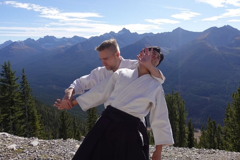 Aikidō students practicing ushiro kubi control technique during class at Calgary Rakushinkan dojo.
