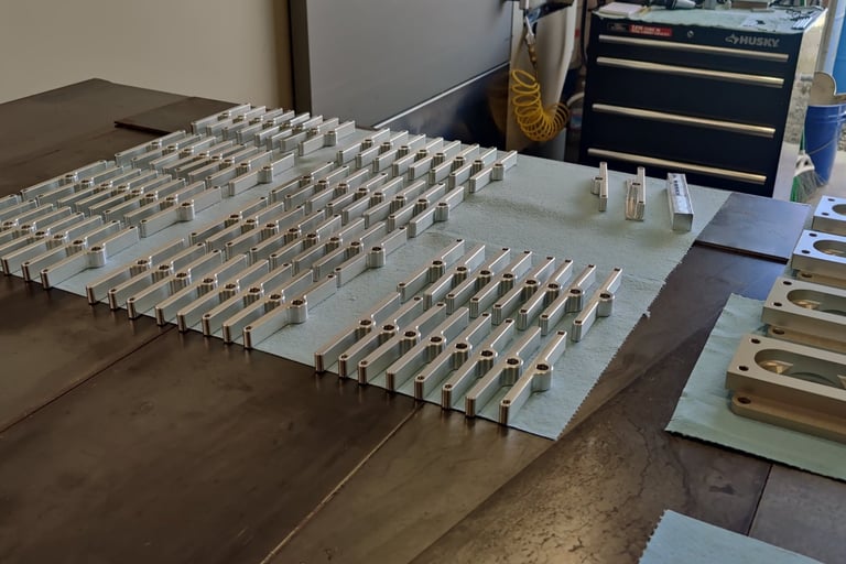 Matthews Innovations Pontiac valve cover load spreaders being machined