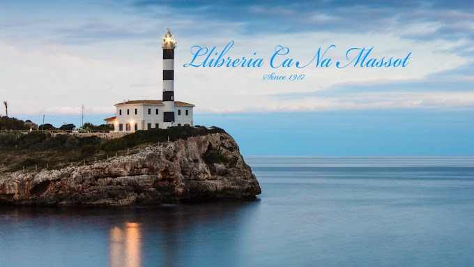 a lighthouse on a rocky cliff with a lighthouse in the background