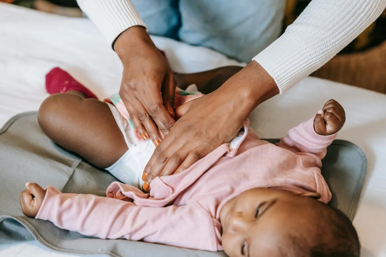 a woman is holding a baby in her lapel