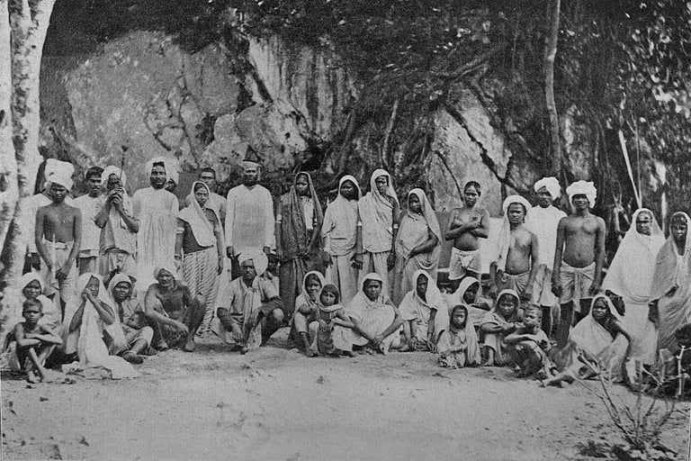 Indentured workers outside their houses somewhere in the caribbean.