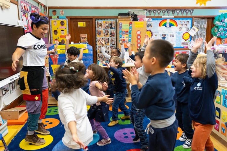 PreK class does a group movement together and has fun.