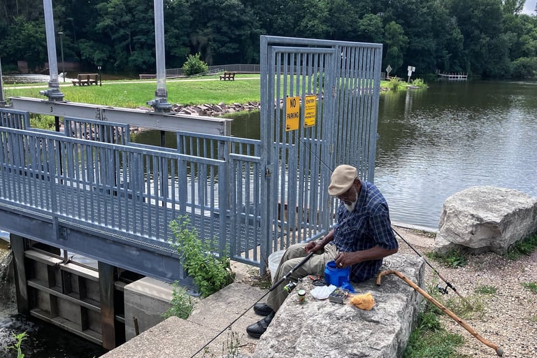 A fisherman baits his hook at the Dam in Montello, Wisconsin. 
