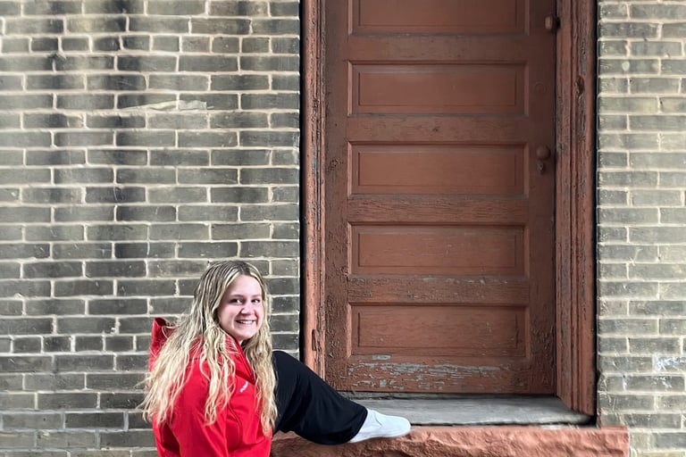 Girl outside of an alley door in Montello, Wisconsin