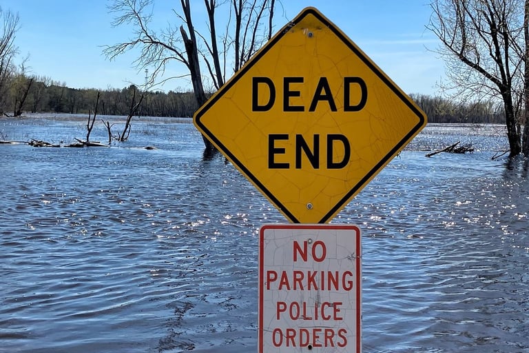 Dead End sign at edge of Fox River in Princeton, Wisconsin 