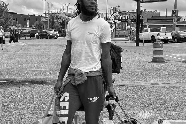 Man waiting at Amtrak Station for Empire Builder in the Wisconsin Dells. 