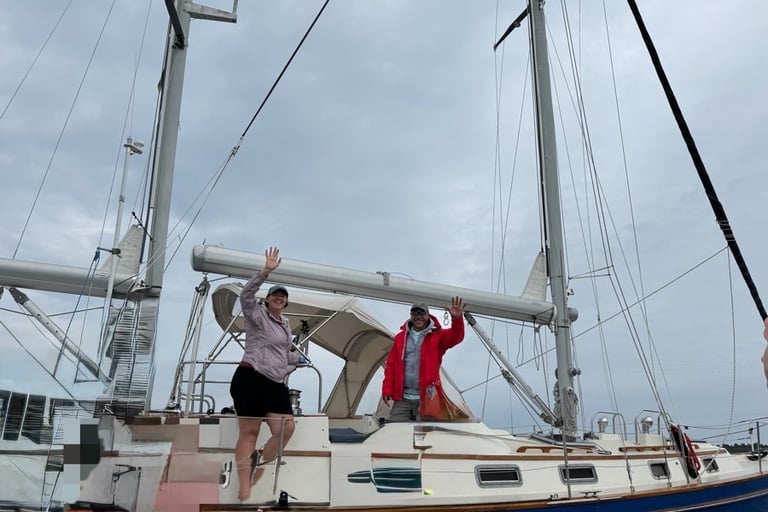 Two captains waving goodbye to their charter customers after a day on the waters of Buzzards Bay