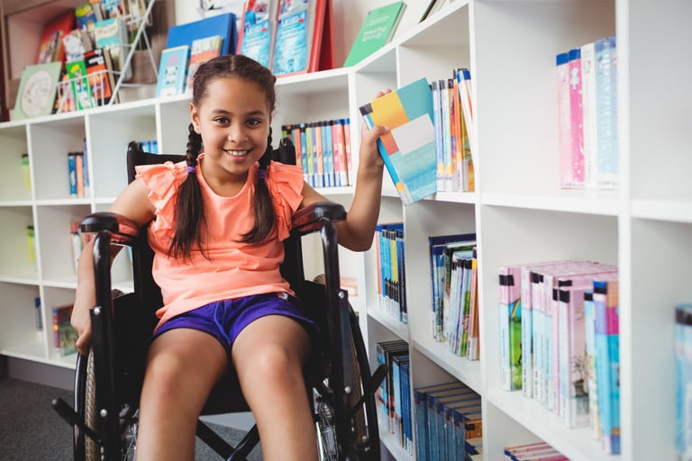 a girl in a wheelchair wheel chair in a library
