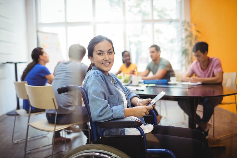 a woman in a wheelchair wheel chair in a room