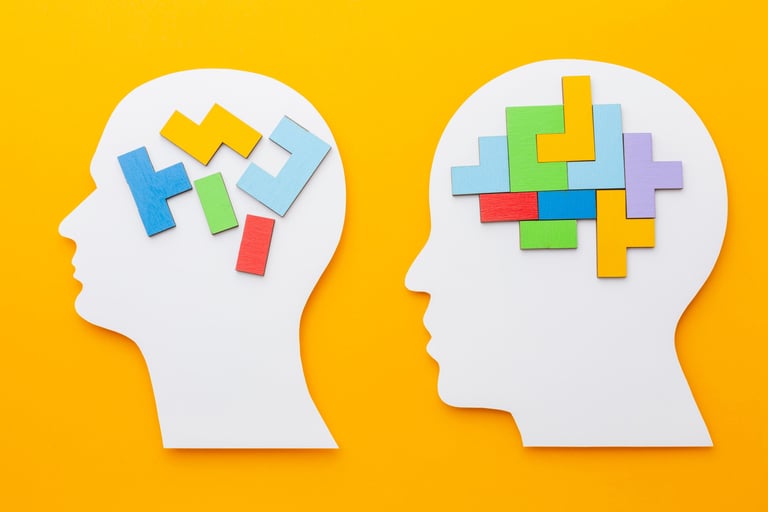 two pieces of paper cutouts of a head and a head of a person '