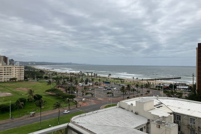 a view of a beach with a view of the ocean in durban, South Africa