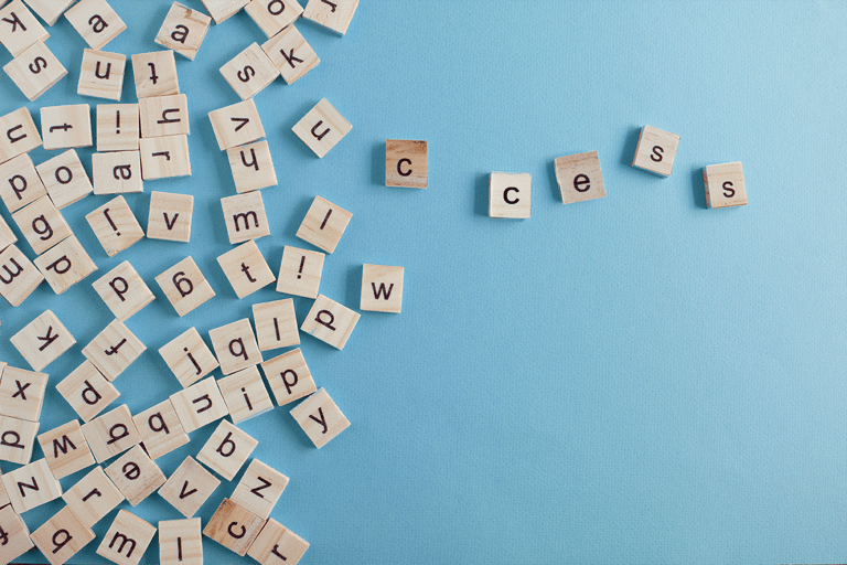 letter tiles spelling the word 'success'