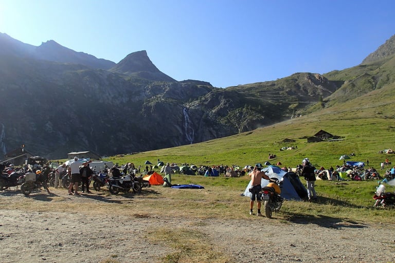 a group of people standing at Stella Alpina around a mountain