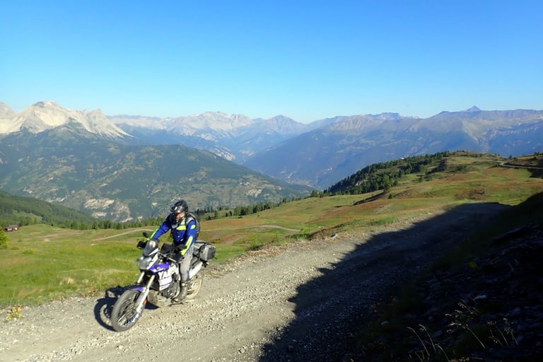 a person on a dirt bike on a dirt road
