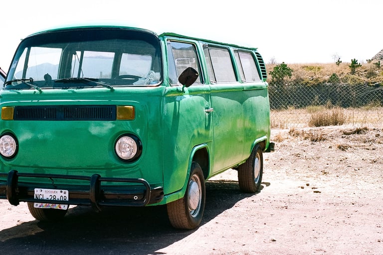 an old green Volkswagon minivan