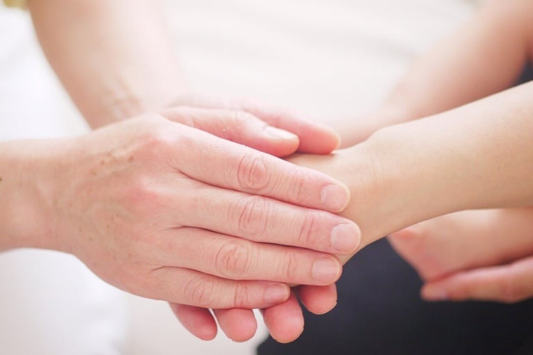 Holding hands for comfort and prayer