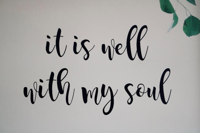 a wall with a quote about 'it is well with my soul'