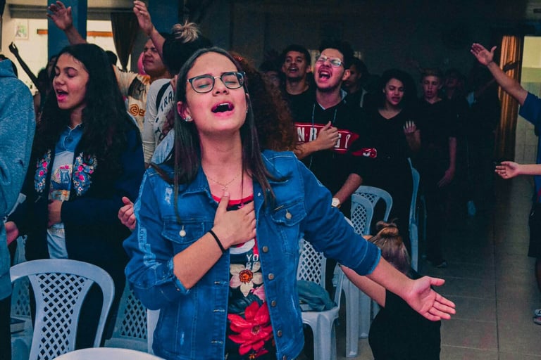 a group of people worshipping God in the church