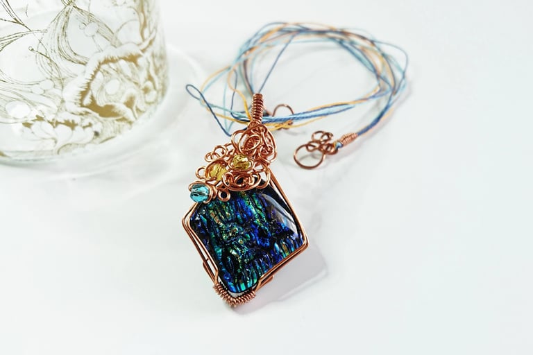 Copper wire wrapped fused glass of blues and greens pendant 