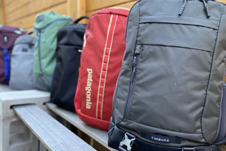 lightweight waterproof travel backpack for hiking and city bunch of backpacks lined up on a bench
