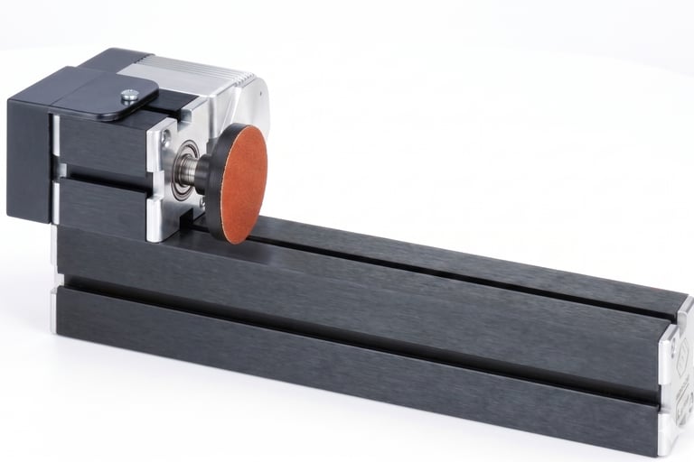 Refining wooden puzzle joints perfectly flush using a disc sanding station.
