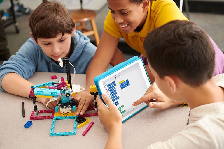 Teenagers working together to build and code a complex, multi-functional robot.