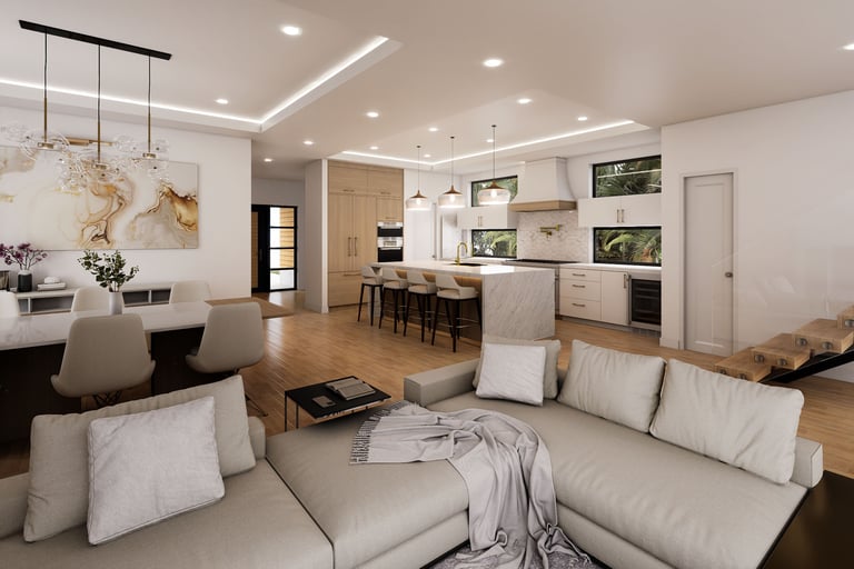 Modern open-concept interior featuring a marble kitchen island, neutral sectional sofa, and recessed tray ceiling.