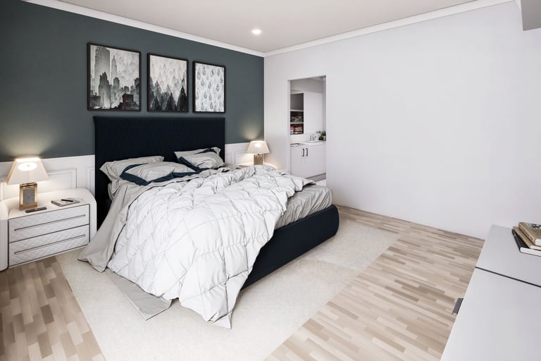 Modern bedroom with a teal accent wall, tan tufted headboard, white dressers, and light wood flooring.