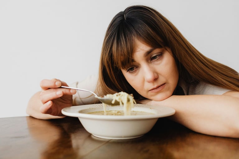 Photo By: Kaboompics.com: https://www.pexels.com/photo/close-up-of-a-sad-woman-eating-soup-