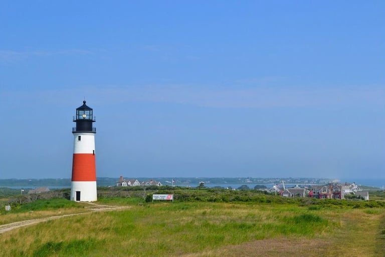 a lighthouse in the distance with a path leading to the lighthouse