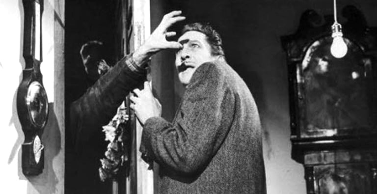Vincent Price wards off the vampires. The Last Man on Earth (1964)
