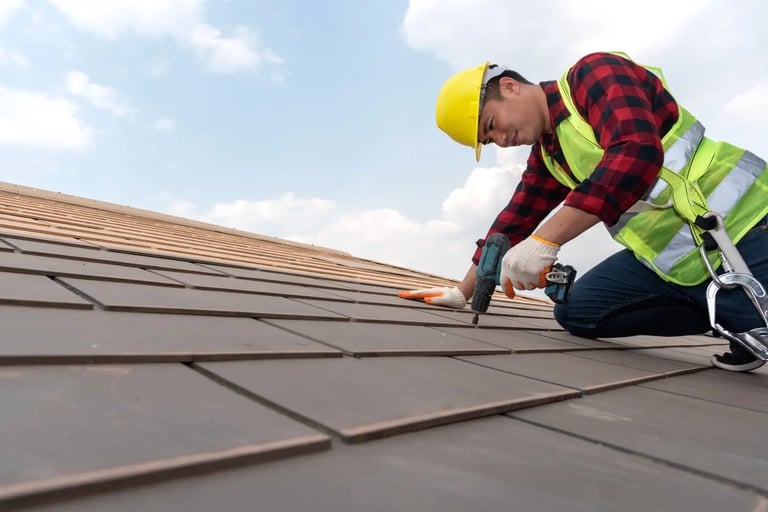 a roof worker is using a drill to fix the roof